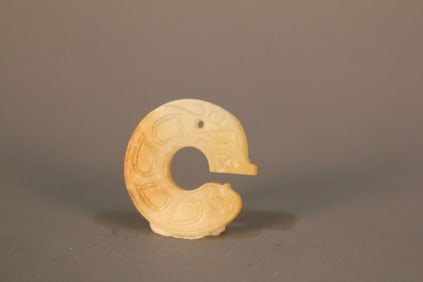 A Chinese Carved Jade Dragon Pendant