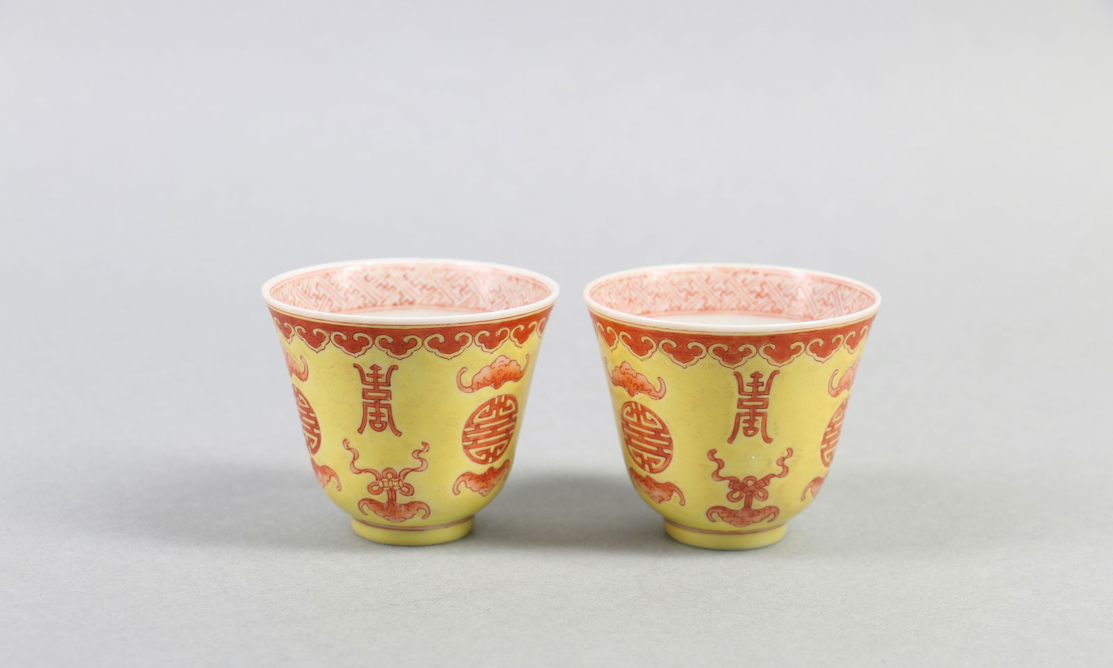 A Pair of Chinese Yellow Ground Alum Red Porcelain Cups: Ht. 5cm, Diam. 6cm