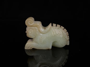 A Chinese Carved Jade Kneeling Figure