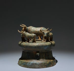 A Chinese Bronze Drum with Bulls Statuette