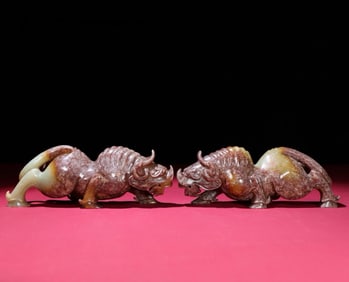 A Pair of Chinese Carved Jade Rhino Statuettes