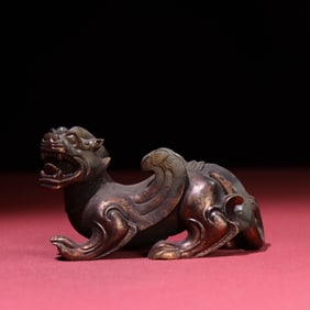 A Chinese Carved Jade Foo-Dog Statuette