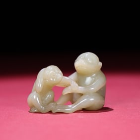 A Chinese Carved Jade Monkey Statuette