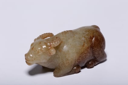 A Chinese Carved Jade Bull Statuette