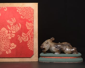 A Chinese Carved Jade Foo-Dog Statuette