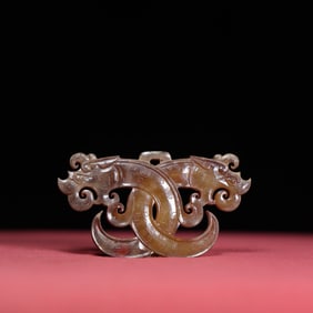 A Chinese Carved Jade Double-Dragon Pendant