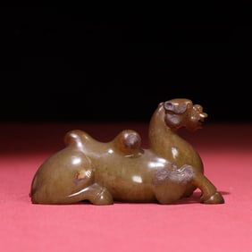 A Chinese Carved Jade Camel Statuette
