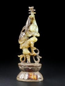 A Chinese Carved Jade Dancing Musician