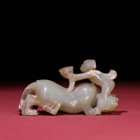 A Chinese Carved Jade Foo-Dog Statuette