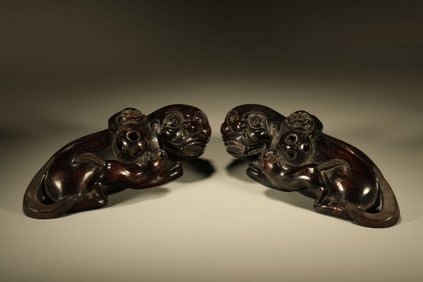 A Pair of Chinese Carved Hardwood Foo-Dog Paper Weight