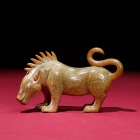 A Chinese Carved Jade Foo-Dog Statuette