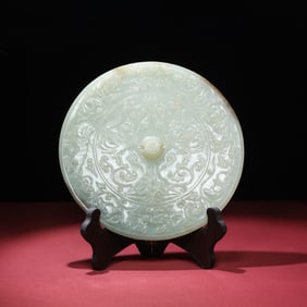 A Chinese Carved Jade Mirror