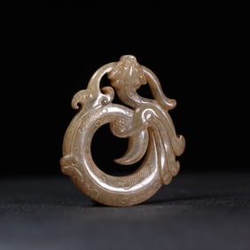 A Chinese Carved Jade Dragon Ring Pendant