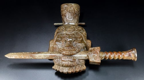 A Chinese Carved Jade Man Head with Sword
