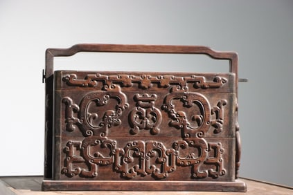 A Chinese Carved Hardwood Box with Handle and Lid
