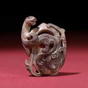 A Chinese Carved Jade Dragon Pendant