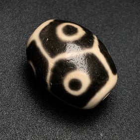 A Chinese Carved Agate DZI Bead