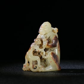 A Chinese Carved Jade Man and Monkey Statuette