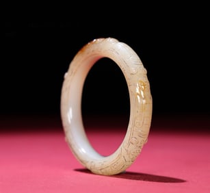 A Chinese Carved Jade Bangle