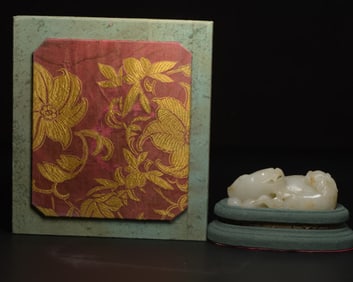 A Chinese Carved Jade Foo-Dog Statuette