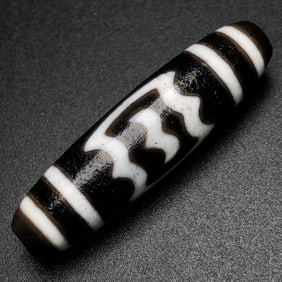A Chinese Carved Agate DZI Bead