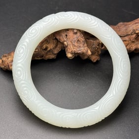A Chinese Carved Jade Bangle