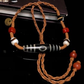 A Chinese Carved Agate DZI Bead Necklace