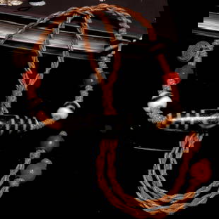 A Chinese Carved Agate DZI Bead Necklace: Lg. 5.7cm, Diam. 1.3cm