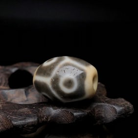 A Chinese Carved Agate DZI Bead