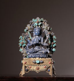 A Chinese Carved Lapiz Lazuli Figure of Buddha with Gilt Bronze Stand