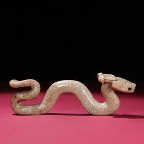A Chinese Carved Jade Dragon Statuette