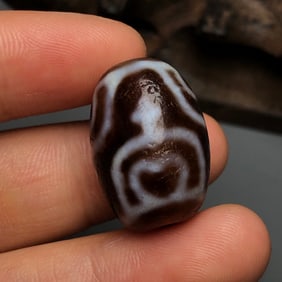A Chinese Carved Agate DZI Bead