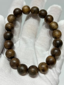 A Chinese Carved Agar-Wood Bracelet