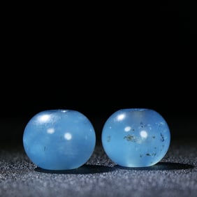 A Pair of Chinese Carved Aquamarine Beads