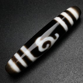 A Chinese Carved Agate DZI Bead