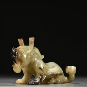 A Chinese Carved Jade Foo-Dog Statuette