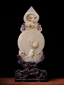 A Chinese Carved Jade Dragon Pendant with Hardwood Stand