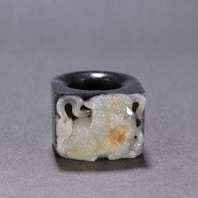 A Chinese Carved Jade Foo-Dog Ring