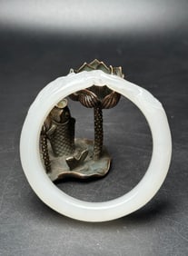 A Chinese Carved Jade Bangle