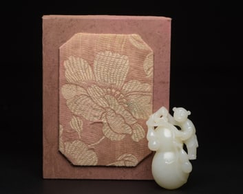 A Chinese Carved Jade Double Gourd Pendant