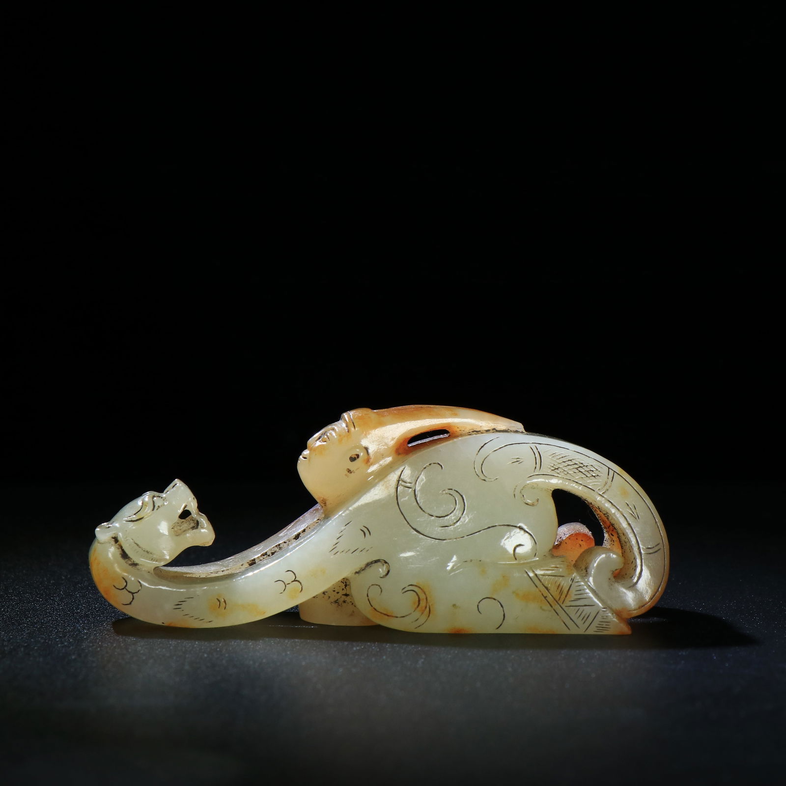 A Chinese Carved Jade Kneeling-Man Belt Buckle