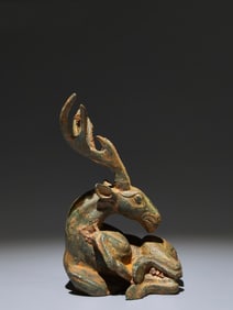 A Chinese Bronze Deer Statuette