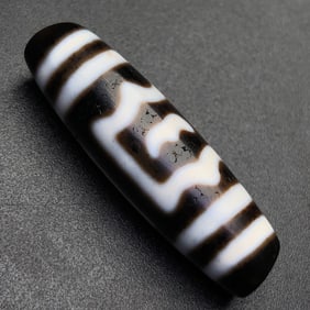 A Chinese Carved Agate DZI Bead