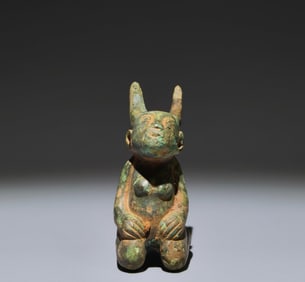 A Chinese Bronze Foo-Dog Statuette