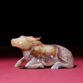 A Chinese Carved Jade Bull Statuette