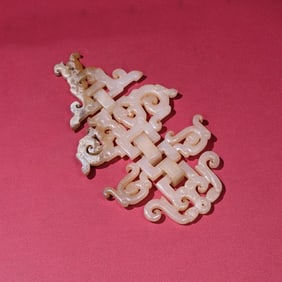 A Chinese Carved Jade Dragon and Phenix Pendant
