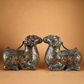 A Pair of Chinese Gilt Bronze Goat Statuettes