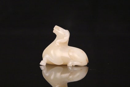 A Chinese Carved Jade Goat Statuette
