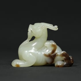 A Chinese Carved Jade Foo-Dog Statuette