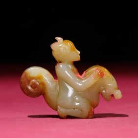 A Chinese Carved Jade Foo-Dog with Rider Statuette